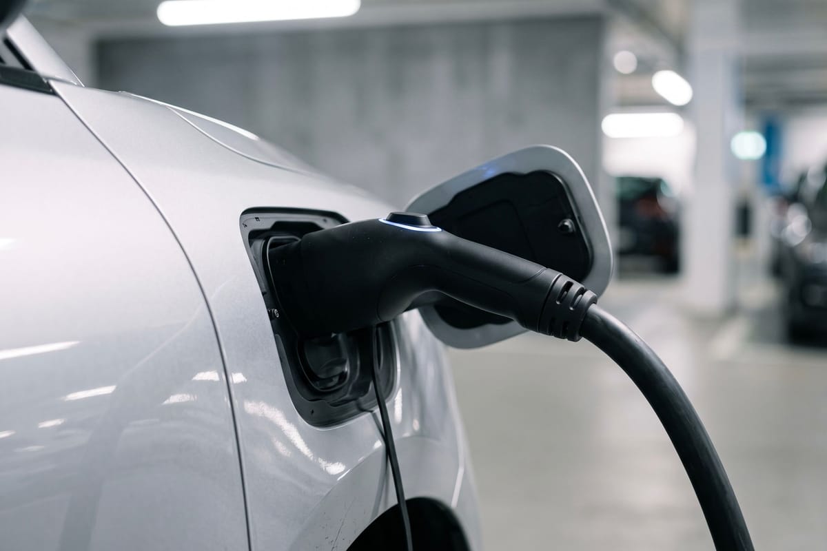 Charging connector plugged into an electric car
