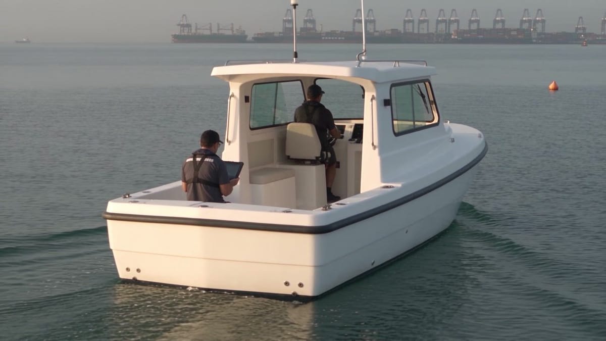 Electric workboat on a sea trial in open coastal water